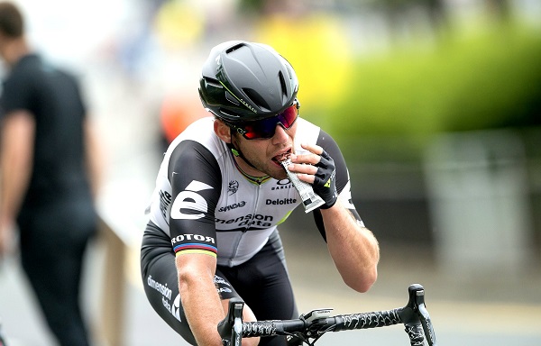 A Professional Cyclist Having Healthy Nutritional Chocolate While His Bicycle Riding.